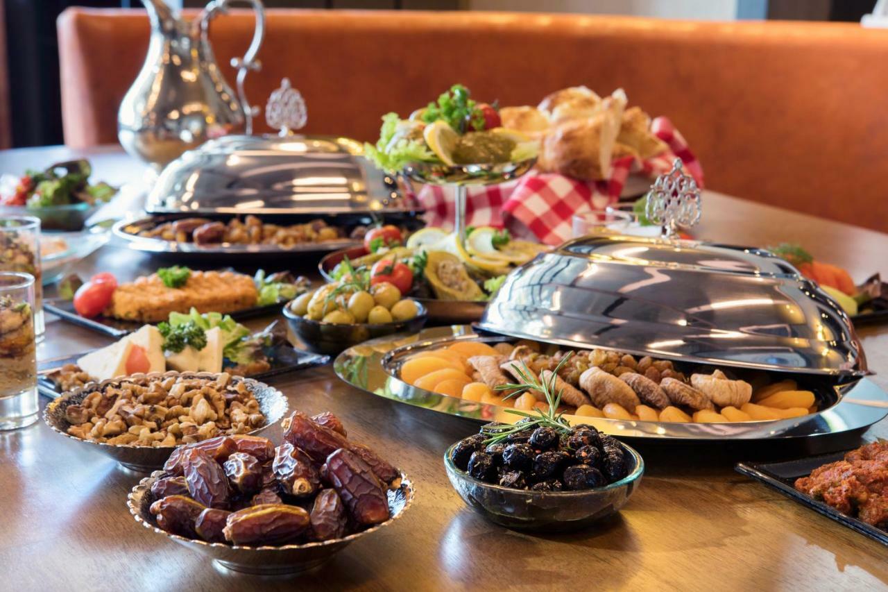 Wish More Hotel Istanbul Exterior photo A selection of dishes at a buffet